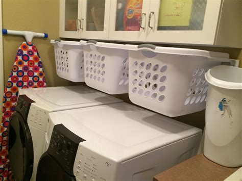 metal box in laundry closet|hanging laundry basket.